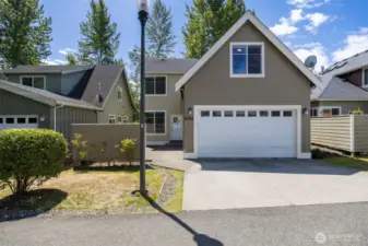 This is the back of the home with the bonus room over the garage and the private courtyard off the back door that opens to the dining area and kitchen, so it is great for barbeques!