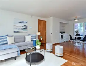 Family room next to entryway, door to garage