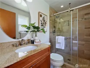 Master bath offers a 5' shower with tile enclosure and two shower heads, the overhead is called a "Rain Dome".   Tile backsplash, floor and tile sink