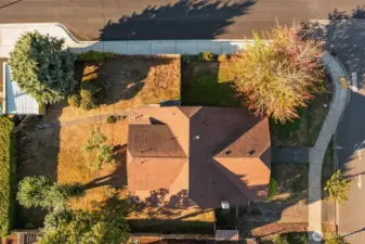 Two places for off-street parking; the one-car garage, seen in the upper left, and the paved driveway, seen in the lower right.
