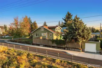 One car garage was recently re-shingled. Dormer is the upper level primary suite the current owners added.