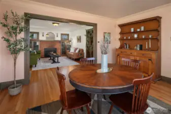 Gracious dining area sits between living room and kitchen. Note all the original millwork and the original hardwood floors. This is a rare find!