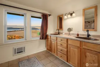 The upstairs primary bath feels like a private retreat.
