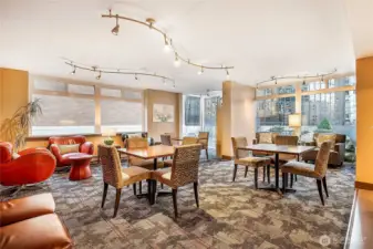 Community room on 4th floor has ample seating, library and kitchen.