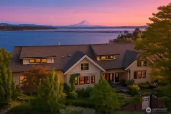 A soft palate illuminates the grand home perched with enchanting views.
