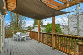 Spacious deck, perfect for entertaining or enjoying serene views of the surrounding landscape. Whether hosting a dinner party or savoring a quiet morning coffee, this space is designed for both elegance and ease