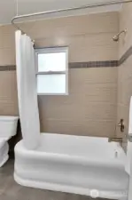Main floor bathroom with original tub