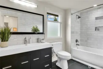 Upstairs guest bathroom is adjacent to the 2 guest bedrooms, There are four updated bathrooms and generous bedrooms ensure comfort for everyone.