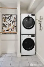 Located between the Kitchen and attached garage is a spacious utiltiy/mud room with laundry, pantry and entrance to the ADU