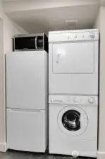 Located between the living and bedroom of the ADU is the laundry and fridge- all appliances stay
