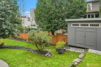 Outdoor shed for gardening equipment, potting shed, or simply storage.  The generator for the house is stored here and it stays.