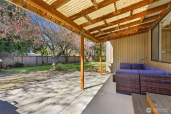 large back patio partially covered