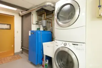 Newer boiler for silent, clean radiant heat throughout the house. Lots more storage and folding/drying space in this large laundry/utility room.