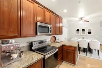 Looking from garage door back to dining room.  This home has plenty of storage not only in the kitchen but also extra space in the garage. (Virtual Staging)