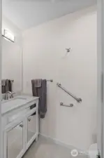 Custom half bathroom attached to primary. Only the best materials used in every space of this home