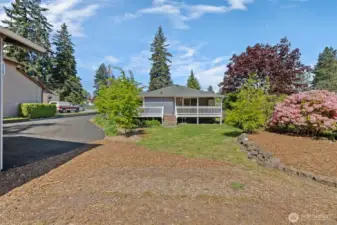 Garden beds, beautiful mature landscaping and tons of space for you to use your imagination