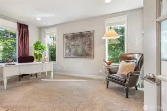 Sunlit office with French doors for privacy.