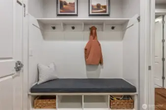 Mudroom with thoughtful storage and organization.