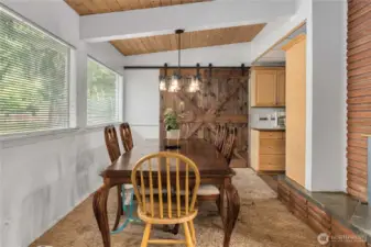 Formal dining room. The barn door on the back side of the room opens to a family room