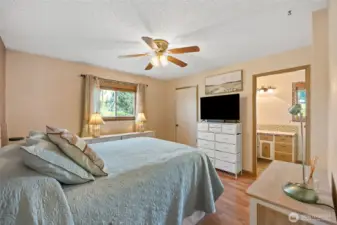 Primary suite with walk in closet and 3/4 bath