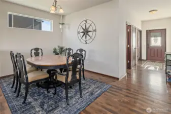 A high window in the dining room and light from the front door keep the entire space filled with natural light.
