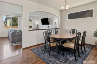 A spacious dining room with a pass-through to the living  room and quick kitchen access—built for easy meals and  effortless hosting.