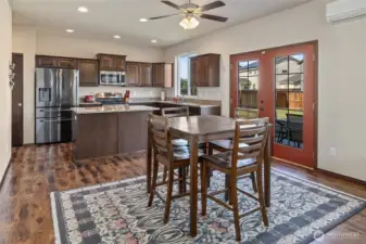 Space for a breakfast table sits perfectly between the kitchen and living room, and offers quick access to the patio.
