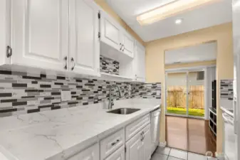Stylish Tiled Backsplash w/Marble Counters