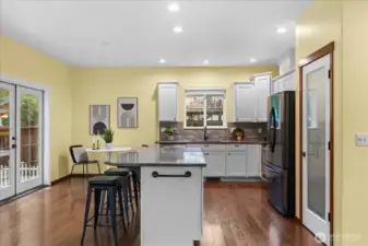 Beautifully remodeled kitchen with granite counters, SS appliances & large island.