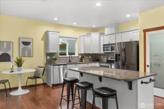 Another view of the kitchen with breakfast nook to the left.