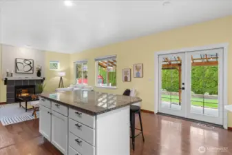 French doors leading to the back covered patio for BBQs & entertaining.