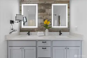 Ensuite with newer vanity, quartz counters, shiplap and lighted mirrors.