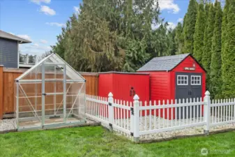 Storage buildings and greenhouse.