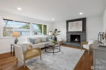 Light and bright living room has big west facing windows.