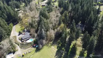Aerial view of property with the valley located at the front of the photo (from north to south)