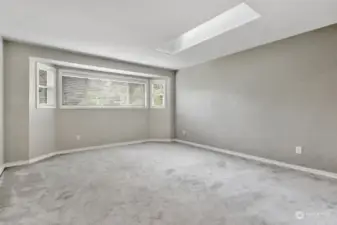 Large primary room with skylights.