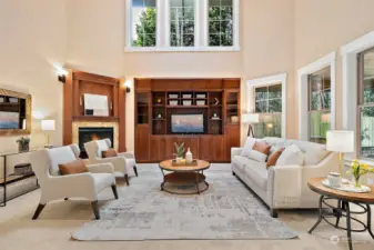 Family room with 2-story vaulted ceilings soaring windows and gas fireplace