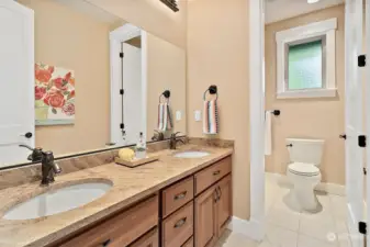 Hallway bathroom with tub on upper level