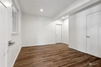 MIL bedroom with a walk-in closet and the door on the back right wall opens to the storage room.