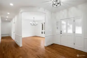 Entry - newly refinished wood floors thruought.