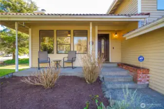 Covered front porch overlooks the park