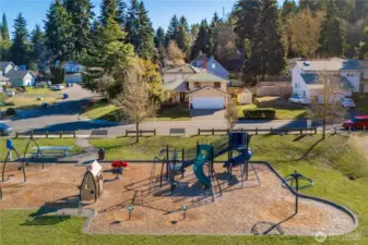 Watch the kids play across the street at the park right from your living room!