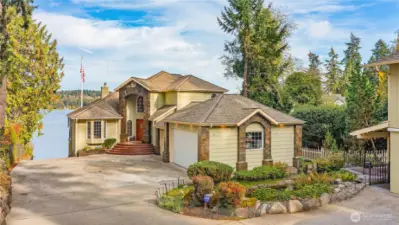No bank beach waterfront Rich Pass looking across at Pleasant Harbor Bainbridge. This private home has a concrete boat ramp, permitted mooring buoy, firepit, pond and 2 car detached garage w/Studio.