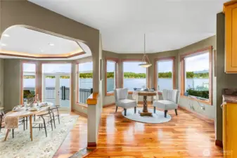 Dining room and to the right is a dining nook or sitting area off kitchen