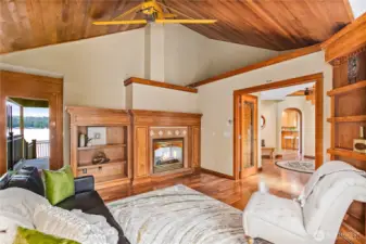 Den with a door to the exterior main deck, see through fireplace, and double doors to the entry. This could be a Primary Bedroom if you wanted main floor primary