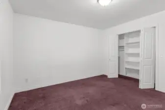 One of two guest bedrooms with custom closet organizer.