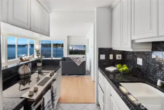 Everything is within easy reach in the kitchen with granite counter tops, new fridge and stove/oven.