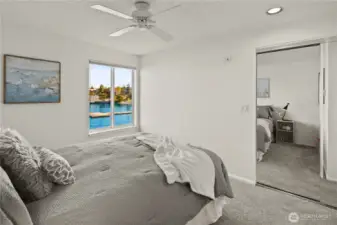 Second/guest bedroom features a view to the Kirkland Marina and lake.
