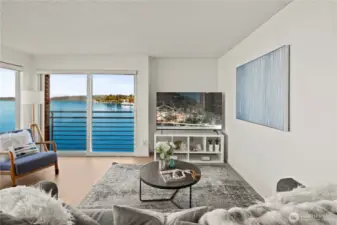 Enjoy the floor to ceiling windows and views over the lake and Olympic mountains from the living room!