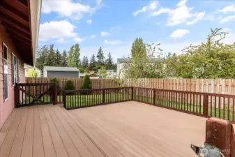 pacious backyard deck, ideal for entertaining and dining